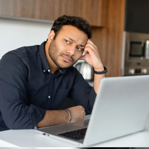 Office worker experiencing burnout from repetitive copy-pasting in spreadsheets.