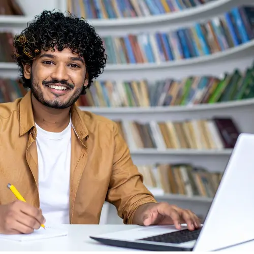 College student upgrading his resume by mastering essential spreadsheet formulas.